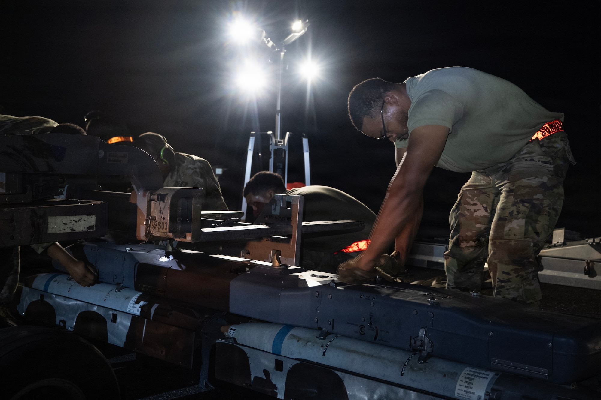 A U.S. Air Force munitions systems specialist assigned to the 1st Special Operations Wing inspects munitions during an Ammo Advanced Performance Experience at Eglin Range, Florida, Nov. 5, 2025.