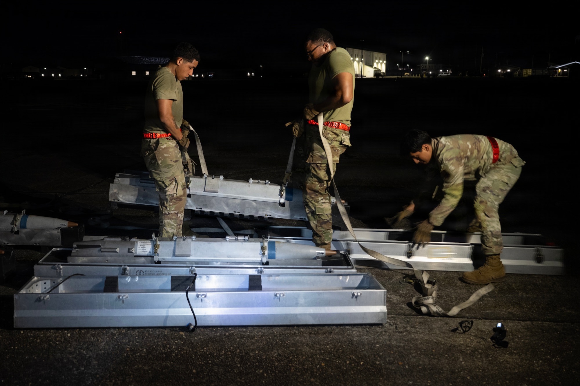 U.S. Air Force munitions systems specialists assigned to the 1st Special Operations Wing unload munitions during an Ammo Advanced Performance Experience at Eglin Range, Florida, Nov. 5, 2025.