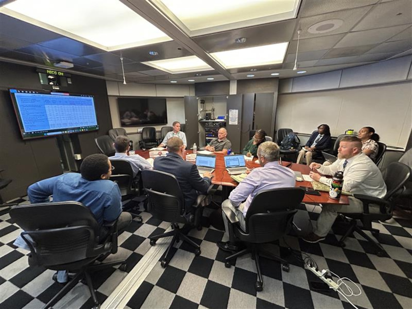 People have a meeting.