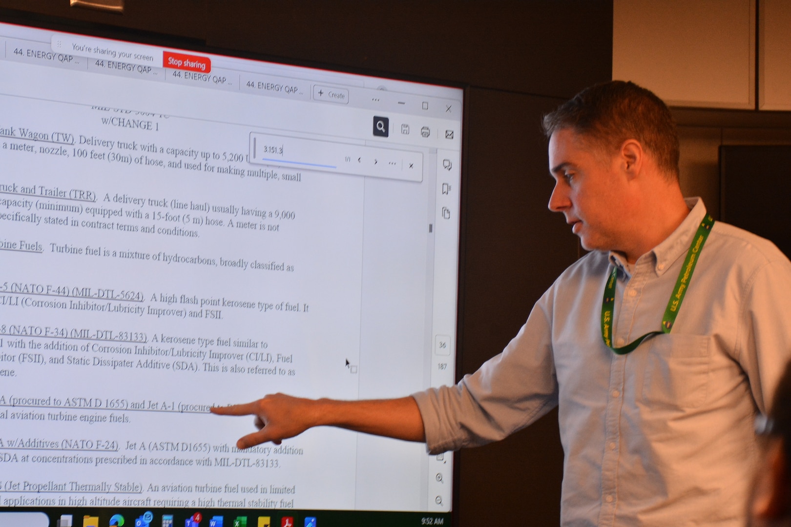 Man reviews document on screen.