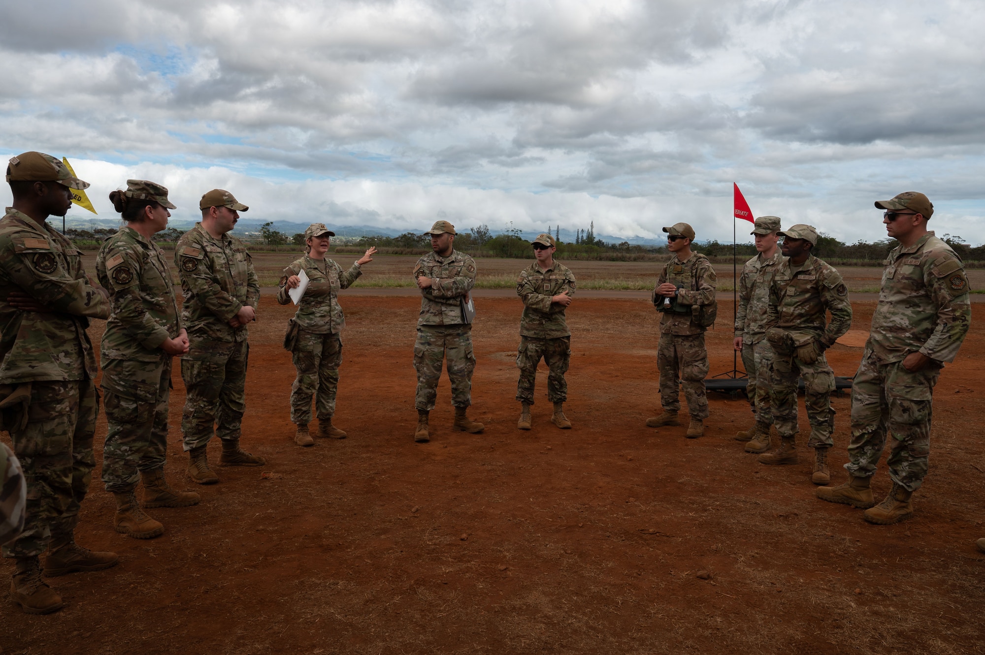 U.S. Air Force Capt. Carol Etuati, 21st Air Task Force nurse, briefs 21st Combat Air Base Squadron members on Casualty Collection Point training during Joint Pacific Multinational Readiness Center 26-01 at Schofield Barracks, Hawaii, Nov. 6, 2025. CCP training involves hands-on exercises that focus on skills to simulate real-world events, reinforcing critical medical readiness and response times. (U.S. Air Force photo by Senior Airman Alondra Cristobal Hernandez)