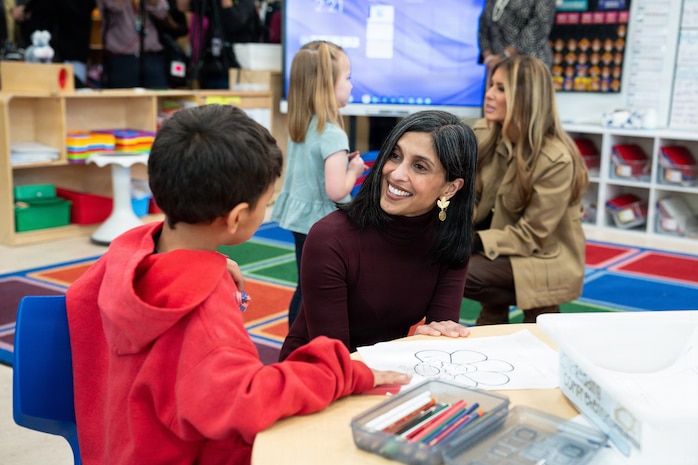 First Lady Melania Trump Helps Student Create Cardstock Turkey at DoDEA Americas DeLalio Elementary School