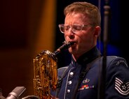 U.S. Air Force Tech. Sgt. Seth Ebersole, baritone saxophonist for the U.S. Air Force Band’s Airmen of Note, plays a solo during the group’s 75th anniversary concert in Alexandria, Va., Sept. 26, 2025. More than 20 alumni of the band attended to celebrate their heritage with approximately 1,000 audience members in attendance. (U.S. Air Force photo by Staff Sgt. Jordan Powell)
