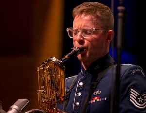 U.S. Air Force Tech. Sgt. Seth Ebersole, baritone saxophonist for the U.S. Air Force Band’s Airmen of Note, plays a solo during the group’s 75th anniversary concert in Alexandria, Va., Sept. 26, 2025. More than 20 alumni of the band attended to celebrate their heritage with approximately 1,000 audience members in attendance. (U.S. Air Force photo by Staff Sgt. Jordan Powell)