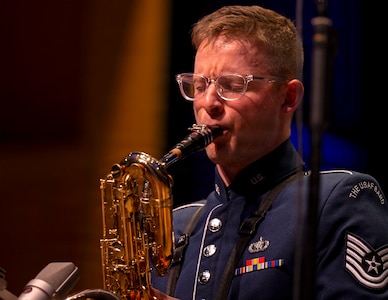 U.S. Air Force Tech. Sgt. Seth Ebersole, baritone saxophonist for the U.S. Air Force Band’s Airmen of Note, plays a solo during the group’s 75th anniversary concert in Alexandria, Va., Sept. 26, 2025. More than 20 alumni of the band attended to celebrate their heritage with approximately 1,000 audience members in attendance. (U.S. Air Force photo by Staff Sgt. Jordan Powell)