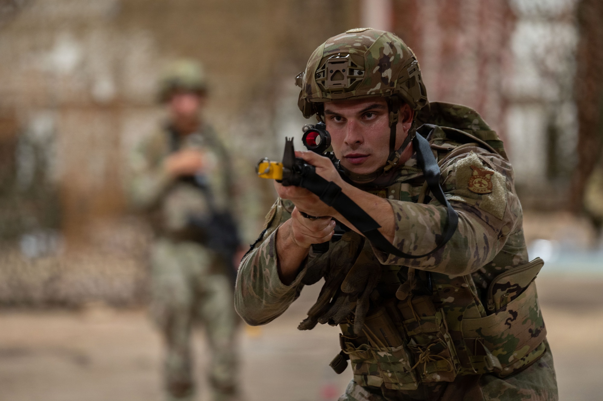U.S. Air Force Senior Airman Adam Blake, 21st Combat Air Base Squadron firefighter, practices shooting stances as part of Close Quarters Battle training during Joint Pacific Multinational Readiness Center 26-01 at Schofield Barracks, Hawaii, Nov. 6, 2025. These training events prepare the 21st CABS to operate in contested environments, increasing combat survivability and lethality, and enhancing readiness for worldwide missions. (U.S. Air Force photo by Senior Airman Alondra Cristobal Hernandez)