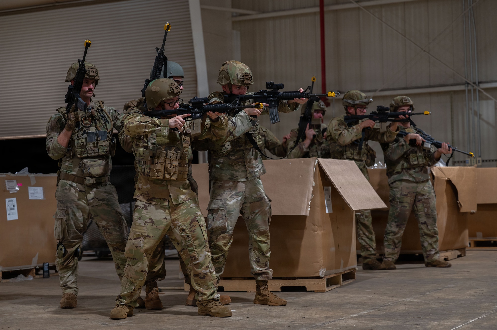 U.S. Airmen assigned to the 21st Combat Air Base Squadron practice shooting stances as part of Close Quarters Battle training during Joint Pacific Multinational Readiness Center 26-01 at Schofield Barracks, Hawaii, Nov. 6, 2025. These training events prepare the 21st CABS to operate in contested environments, increasing combat survivability and lethality, and enhancing readiness for worldwide missions. (U.S. Air Force photo by Senior Airman Alondra Cristobal Hernandez)