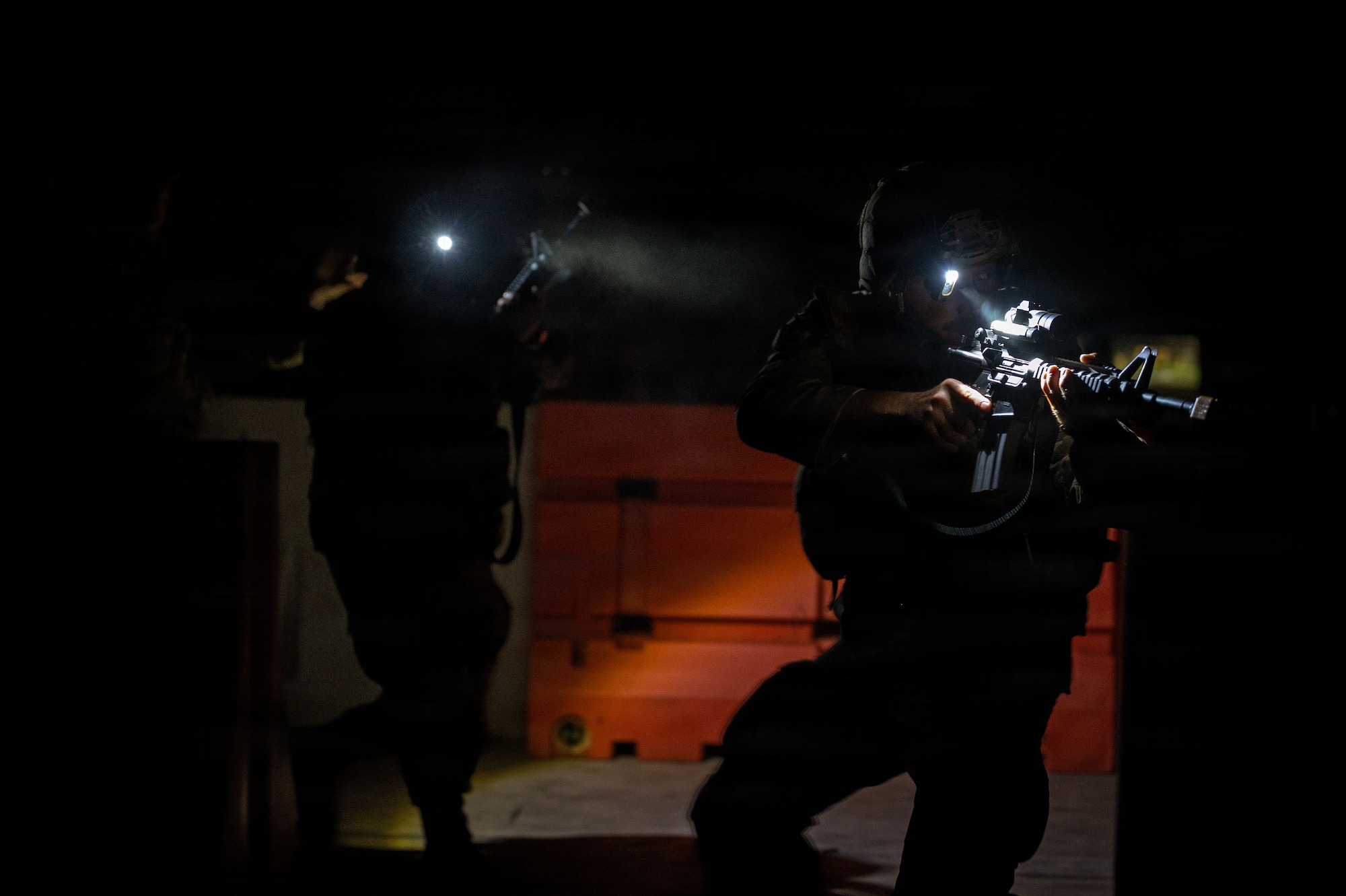 U.S. Air Force Senior Airman Orion Foster, 21st Combat Air Base Squadron conventional munitions maintenance technician, clears a room as part of Close Quarters Battle training during Joint Pacific Multinational Readiness Center 26-01 at Schofield Barracks, Hawaii, Nov. 6, 2025. JPMRC 26-01 emphasized joint operations including close air support, logistics, and base defense, reinforcing the CABS’s role in sustaining combat airpower. (U.S. Air Force photo by Senior Airman Alondra Cristobal Hernandez)
