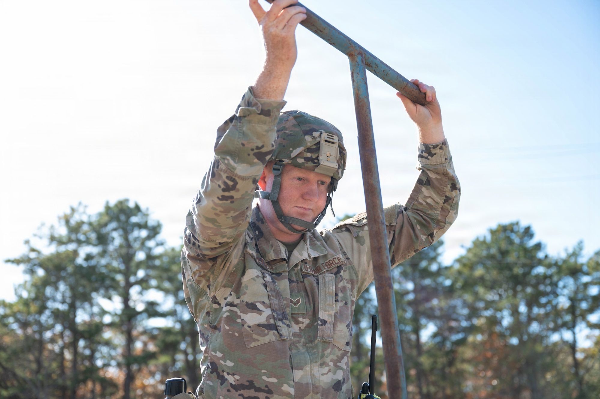 Photo of an Airman closing a water valve.