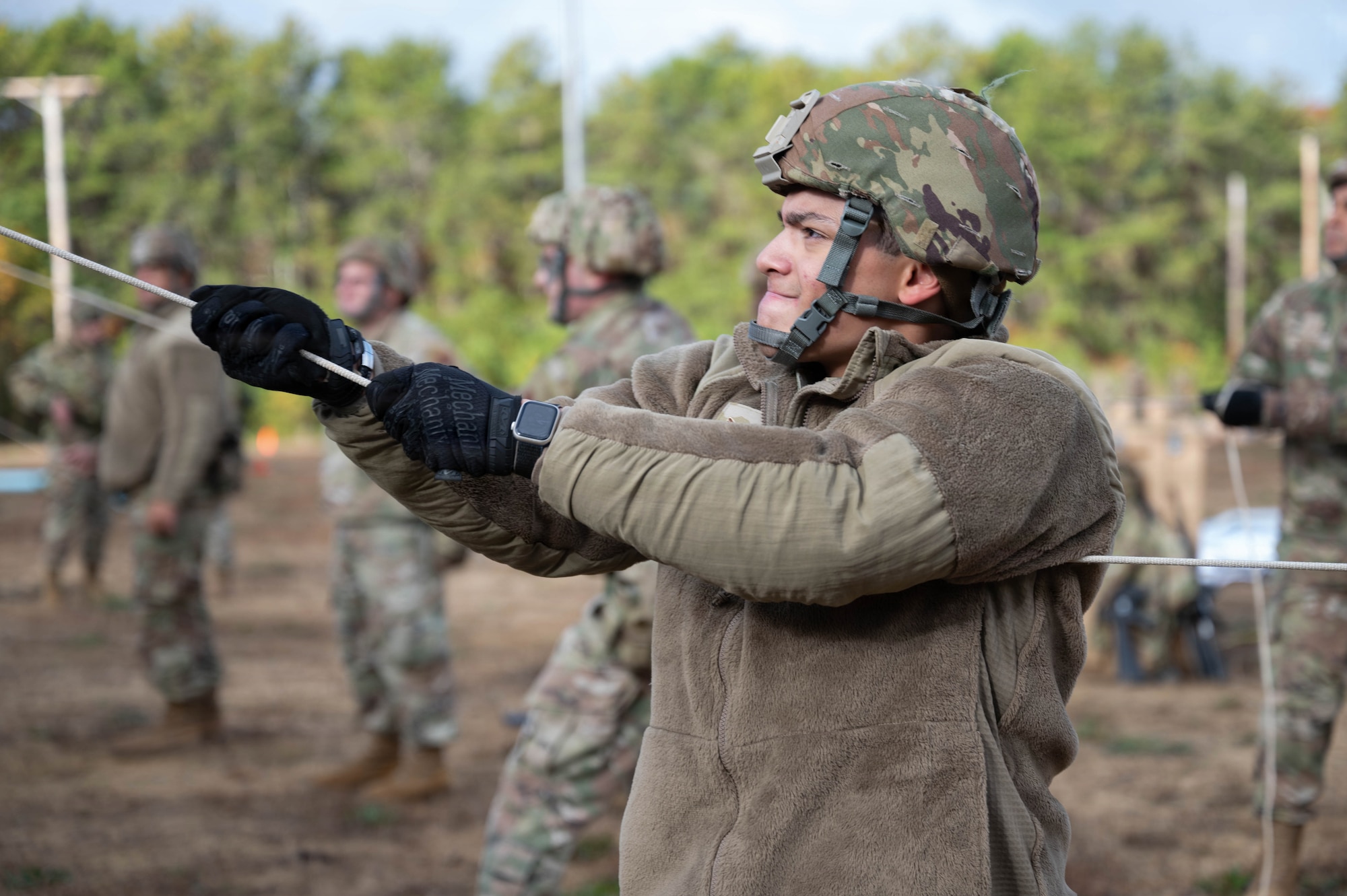 Photo of an Airman building a tent during an exercise.