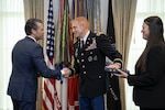 Secretary of War Pete Hegseth congratulating U.S. Army Col. Kevin Bouren after administering the oath of office to Bouren, formally returning him to active duty, on Oct. 2, 2025, at the Pentagon. The event concluded his three-year separation from the service, a period initiated by the Department of Defense’s 2021 COVID-19 vaccine mandate. (Photo Credit: Courtesy Photo)