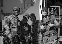 U.S. Airmen assigned to 91st Missile Maintenance Squadron smile before performing maintenance operations during Operation Bully Stick near Minot Air Force Base, North Dakota, Oct. 23, 2025. Operation Bully Stick is an exercise designed to test the wing’s ability to rapidly generate intercontinental ballistic missile readiness under agile combat employment concepts. (U.S. Air Force photo by Airman 1st Class Vincent Padilla)