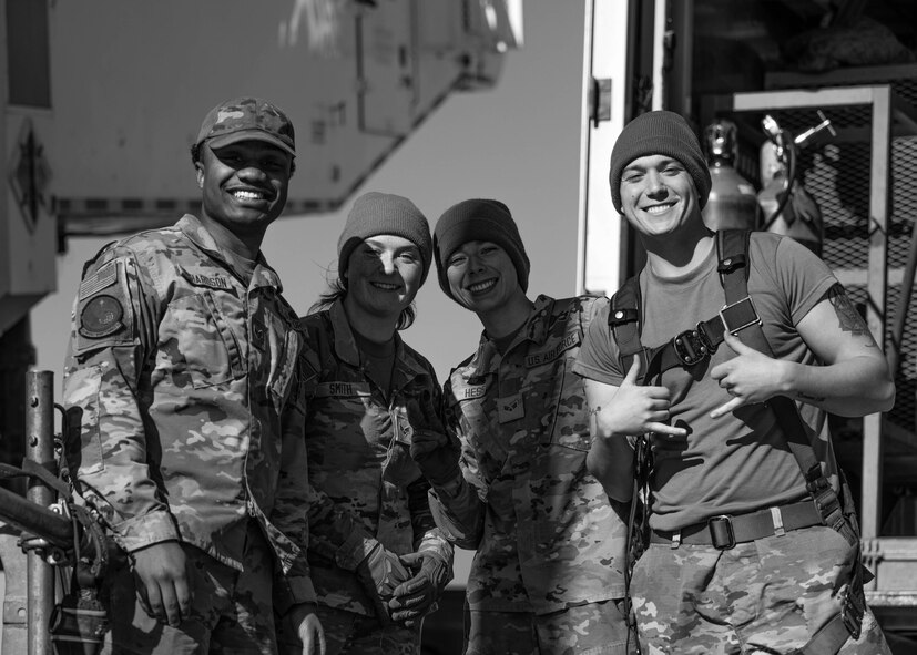U.S. Airmen assigned to 91st Missile Maintenance Squadron smile before performing maintenance operations during Operation Bully Stick near Minot Air Force Base, North Dakota, Oct. 23, 2025. Operation Bully Stick is an exercise designed to test the wing’s ability to rapidly generate intercontinental ballistic missile readiness under agile combat employment concepts. (U.S. Air Force photo by Airman 1st Class Vincent Padilla)