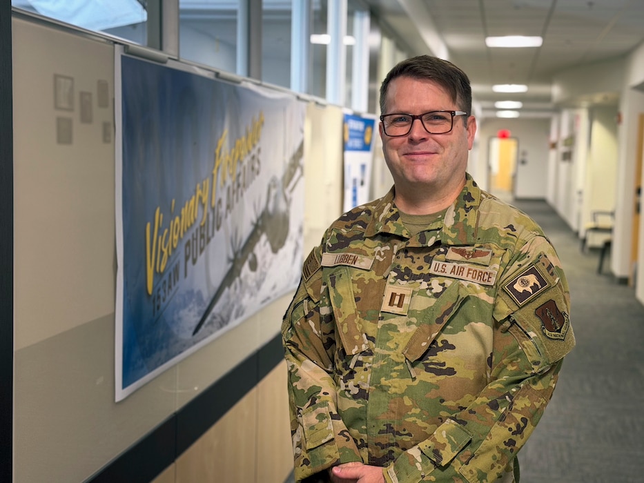 Captain Noah Levin, a flight nurse with the 153rd Aeromedical Evacuation Squadron, poses in front of his work environment.