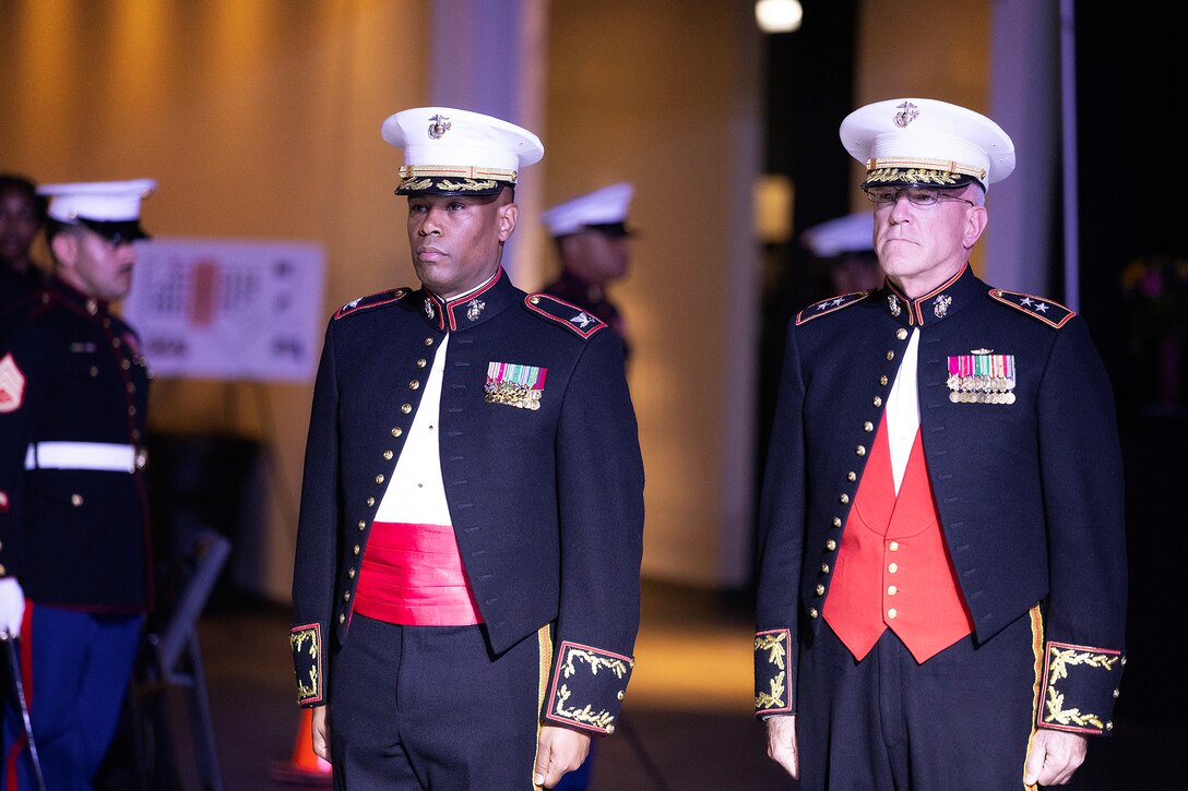U.S. Marine Corps Col. David Merles, commanding officer of Blount Island Command, stands with guest of honor James “Hammer” Hartsell, a retired Marine Corps major general who serves as executive director of the Florida Department of Veterans’ Affairs, prior to a cake-cutting during the 250th Marine Corps birthday ball ceremony hosted Nov. 21 at Deerwood Castle in Jacksonville, Florida. (Official Marine Corps photo by Dustin Senger)