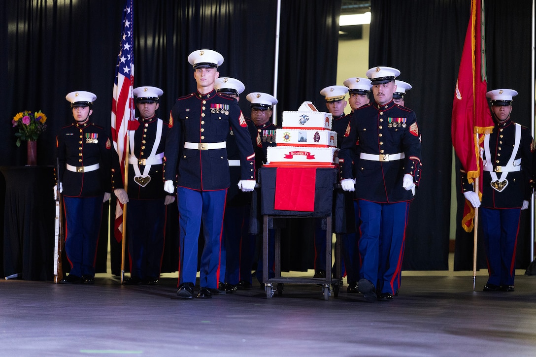U.S. Marines march a birthday cake during the 250th Marine Corps birthday ball ceremony hosted Nov. 21 by Blount Island Command at Deerwood Castle in Jacksonville, Florida. The evening honored generations of service shared between Marine Corps Support Facility Blount Island and the surrounding Jacksonville community. (Official Marine Corps photo by Dustin Senger)