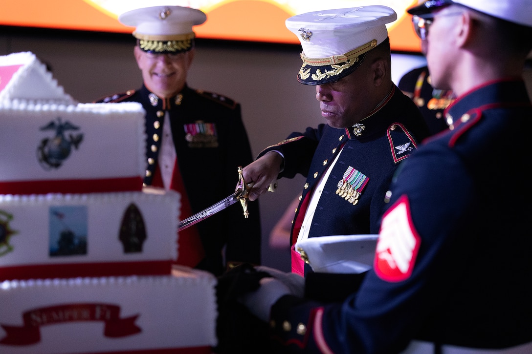 U.S. Marine Corps Col. David Merles, commanding officer of Blount Island Command, cuts a piece of cake for guest of honor James “Hammer” Hartsell, a retired Marine Corps major general who serves as executive director of the Florida Department of Veterans’ Affairs, during the 250th Marine Corps birthday ball hosted Nov. 21 at Deerwood Castle in Jacksonville, Fla. (Official Marine Corps photo by Dustin Senger)