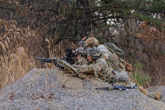 The weapons squad from C Co. 4-9 Infantry engages designated targets during a platoon live fire exercise at the Rodriguez Live Fire Complex in South Korea.