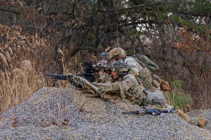The weapons squad from C Co. 4-9 Infantry engages designated targets during a platoon live fire exercise at the Rodriguez Live Fire Complex in South Korea.