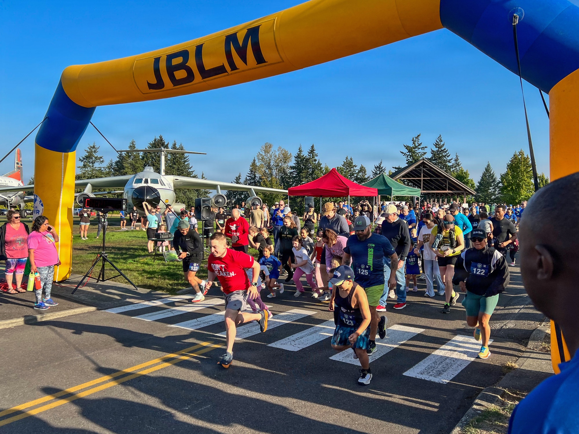 wide shot of a group of runners starting a marathon