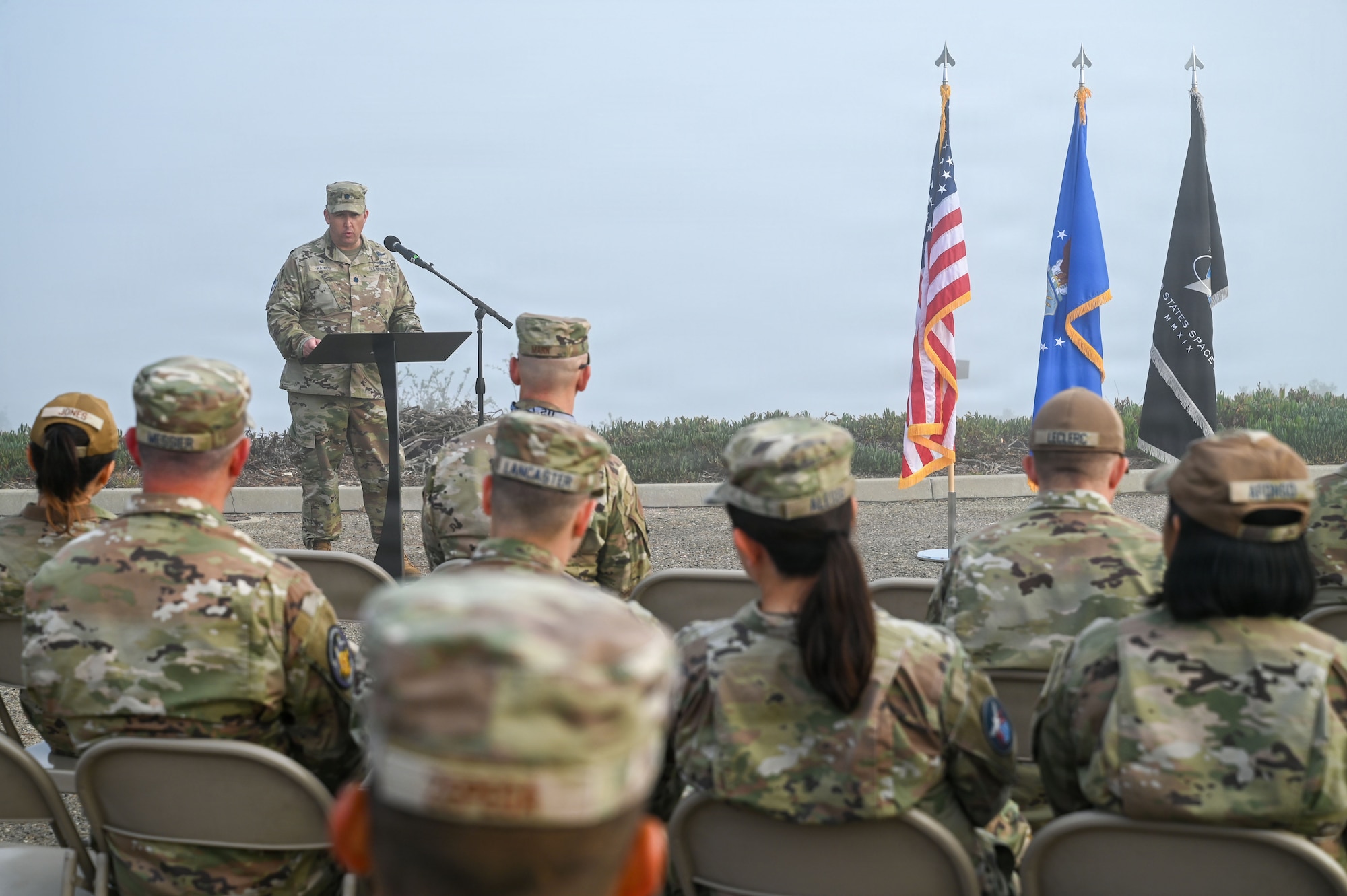 a man speaks at a podium
