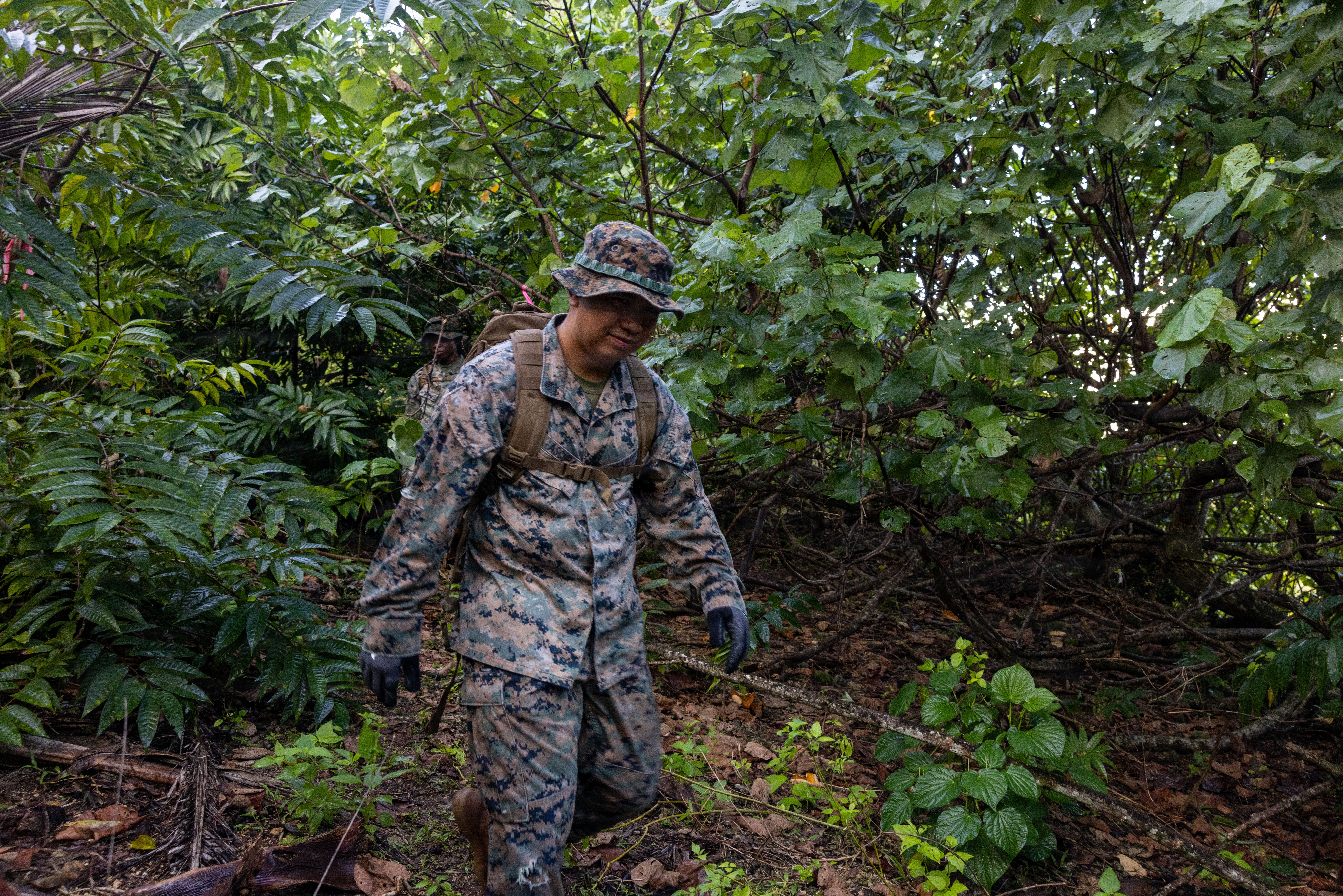 U.S. Marine Corps Sgt. Darren Ascura, network administrator, Headquarters Company, Marine Corps Base Camp Blaz, hikes towards Tweed’s Cave at MCB Camp Blaz, Guam, Nov. 20, 2025. Tweed’s Cave is the historically significant site that was the hiding place of U.S. Navy Radioman First Class George R. Tweed during the Imperial Japanese occupation of the island of Guam during World War II, from Oct. 21, 1942, to July 10,1944. Tweed was seen as a symbol of the United States and CHamoru peoples’ friendship and bond, and the promise that the U.S. would return to end the occupation and atrocities that were committed during the Imperial Japanese occupation. (U.S. Marine Corps photo by Lance Cpl. Rey Moreno Marilao)