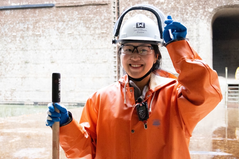 A Seattle District teammate takes a quick break from scraping barnacles off one of the large lock culverts at at the Hiram M. Chittenden Locks, an annual event which prevents injury to migrating fish.
