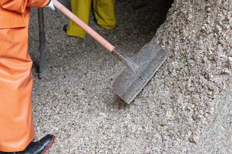 Seattle District teammates scrape barnacles from one of the large lock culverts at at the Hiram M. Chittenden Locks, an annual event which prevents injury to migrating fish.