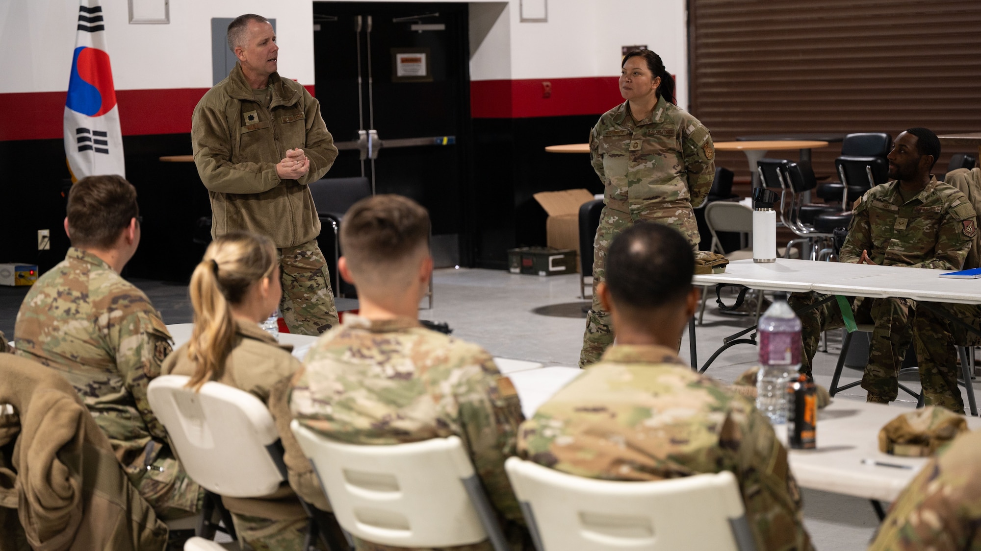 U.S. Air Force Lt. Col Kirk Hull, center left, 51st Civil Engineer Squadron commander, speaks with 51st CES Airmen at Osan Air Base, Republic of Korea, Nov. 17, 2025. The Haetae Leadership Academy aims to strengthen Airmen's ability to lead, follow and operate effectively when called upon. (U.S. Air Force photo by Senior Airman Rome Bowermaster)