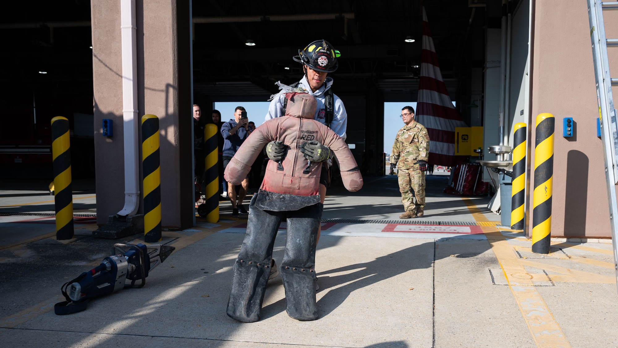 U.S. Air Force Senior Airman Josias Pujols, center, 51st Civil Engineer Squadron firefighter driver operator, participates in a team building workout at Osan Air Base, Republic of Korea, Nov. 18, 2025. The program prepared Airmen to lead across multiple mission areas, enhancing teamwork and readiness throughout the 51st Fighter Wing. (U.S. Air Force photo by Senior Airman Rome Bowermaster)