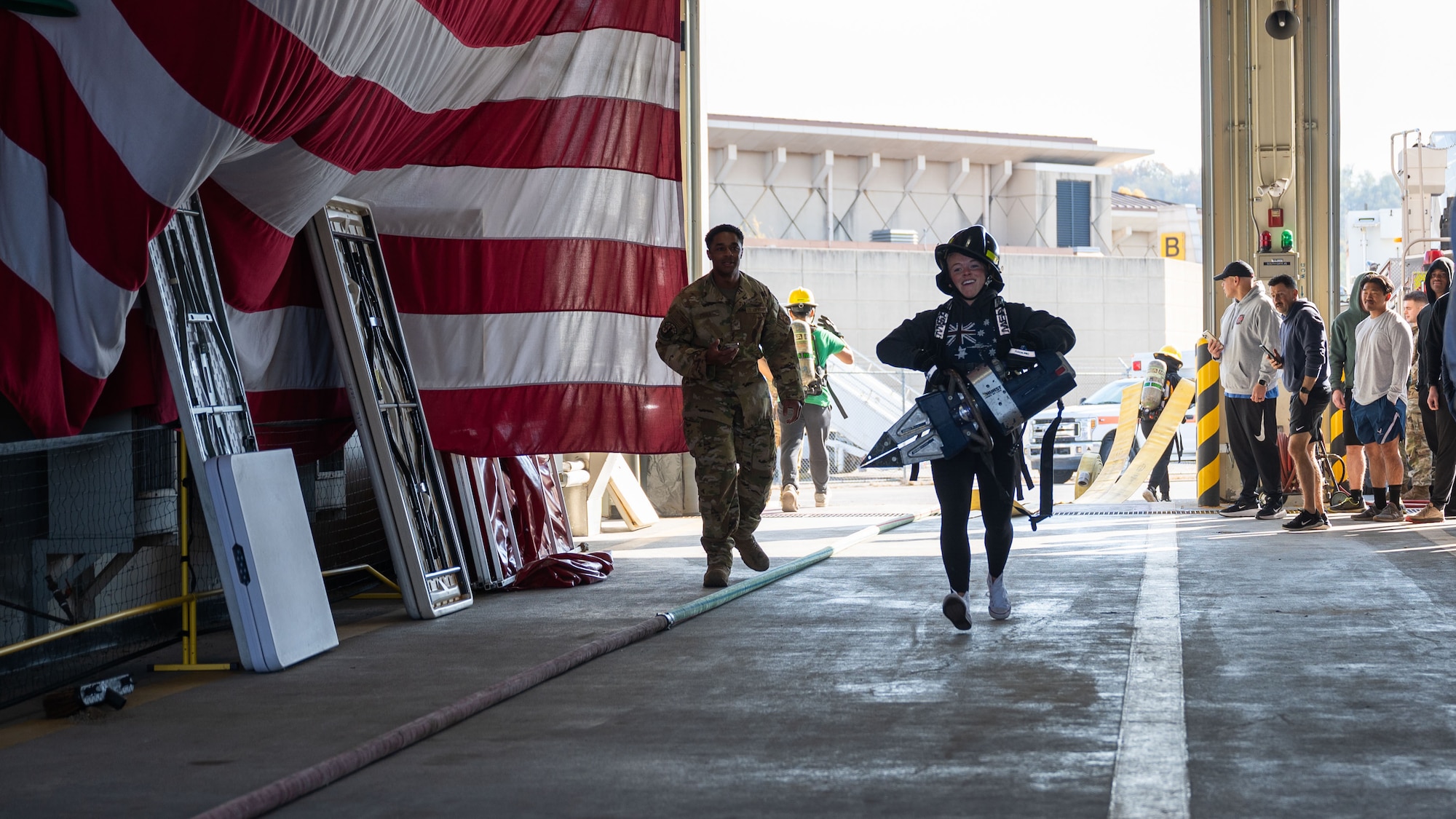 U.S. Air Force Staff Sgt. Cashley Redd, center, 51st Civil Engineer Squadron emergency management craftsman, participates in a team building workout at Osan Air Base, Republic of Korea, Nov. 18, 2025. By connecting Airmen across CE fields, the Haetae Leadership Academy helped develop resilient leaders who understand how their roles contribute to combat airpower generation. (U.S. Air Force photo by Senior Airman Rome Bowermaster)