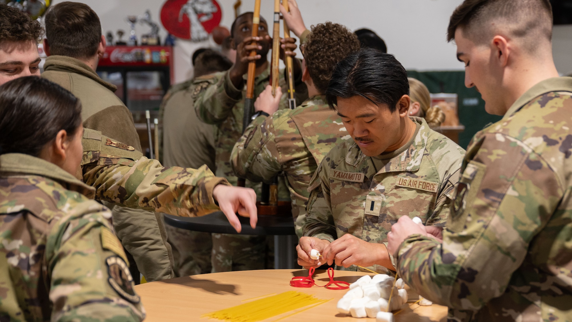 U.S. Air Force 1st Lt. Shyo Yamamoto, center, 51st Civil Engineer Squadron planning and energy officer in charge, participates in a team building activity at Osan Air Base, Republic of Korea, Nov. 19, 2025. This year marked the third iteration of the Haetae Leadership Academy. This iteration introduced officers to participate and lead teams amongst enlisted Airmen. (U.S. Air Force photo by Senior Airman Rome Bowermaster)