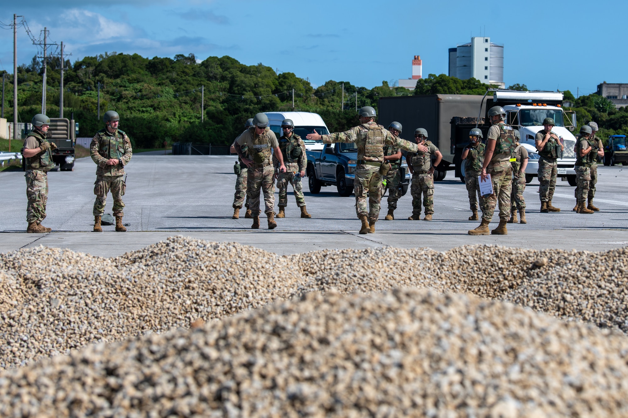 U.S. Air Force Airmen from the 18th Civil Engineer Squadron perform an unexploded ordinance sweep of a crater formed by a simulated air strike during base-wide readiness exercise BH 26-1 at Kadena Air Base, Japan, Nov. 6, 2025. Removing UXOs is one of the first steps in rapid airfield damage repair and is essential to regenerating combat airpower quickly and safely. (U.S. Air Force photo by Airman 1st Class Francisco Huerta)
