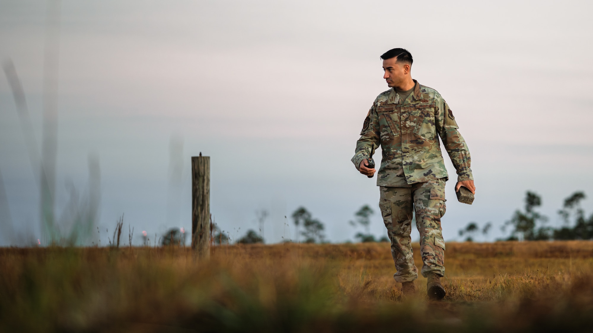 Airman cleans debris