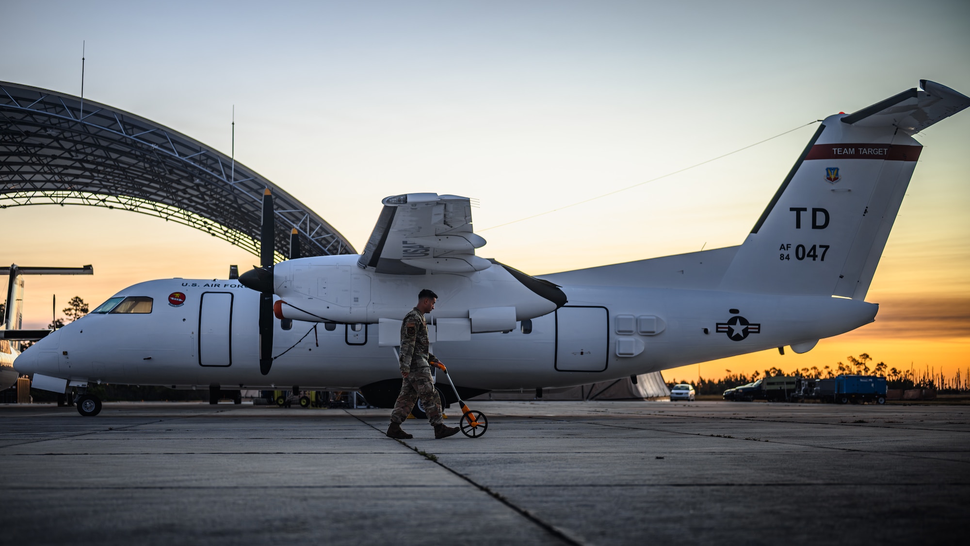 Airman cleans debris