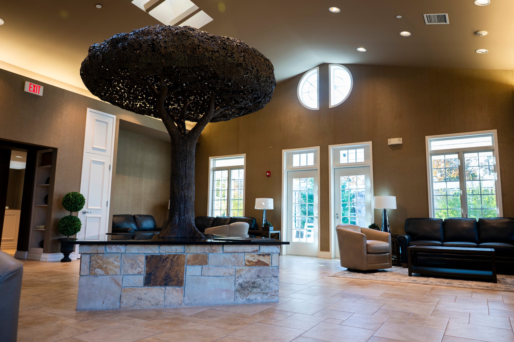 The “Freedom Oak”, a bronze oak tree sculpture gifted by the Fisher House Foundation stands inside the Meditation Pavilion at the Center for Families of the Fallen, Dover Air Force Base, Delaware, Nov. 18 2025. The 1,714 square foot Meditation Pavilion provides a quiet place for families to gather, pray and reflect during their stay at the Fisher House. The pavilion is used as a gathering place for families, and is the first and only one of its kind. (U.S. Air Force photo by Staff Sgt. Frank Rohrig)