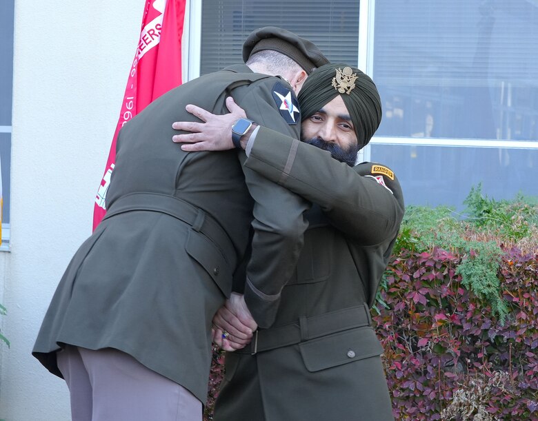 U.S. Army Corps of Engineers – Japan Engineer District (USACE JED) Commander, Col. Patrick Biggs, left, embraces newly promoted Lt. Col. Simratpal “Simmer” Singh, JED’s deputy commander, during his promotion ceremony at the District’s headquarters on Camp Zama, Japan, Nov. 26th, 2025.