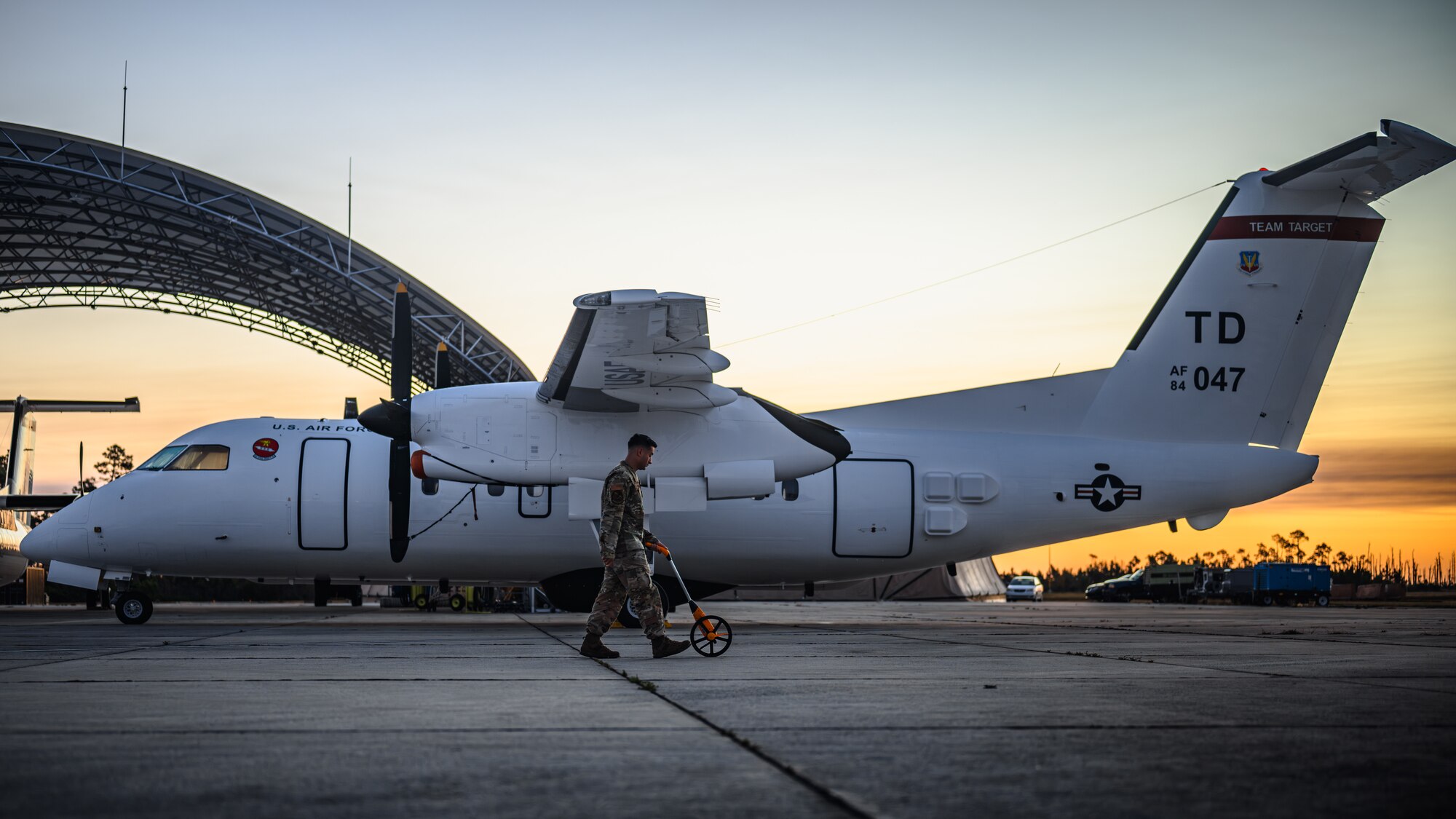 Airman cleans debris