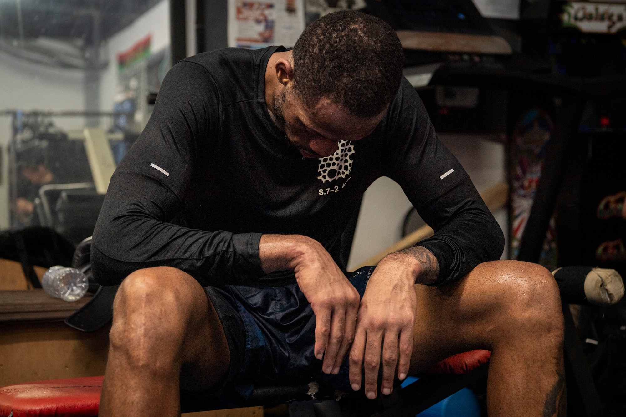U.S. Air Force Senior Airman Craig Jeudy, Fifth Air Force technical support technician, rests after a training session.