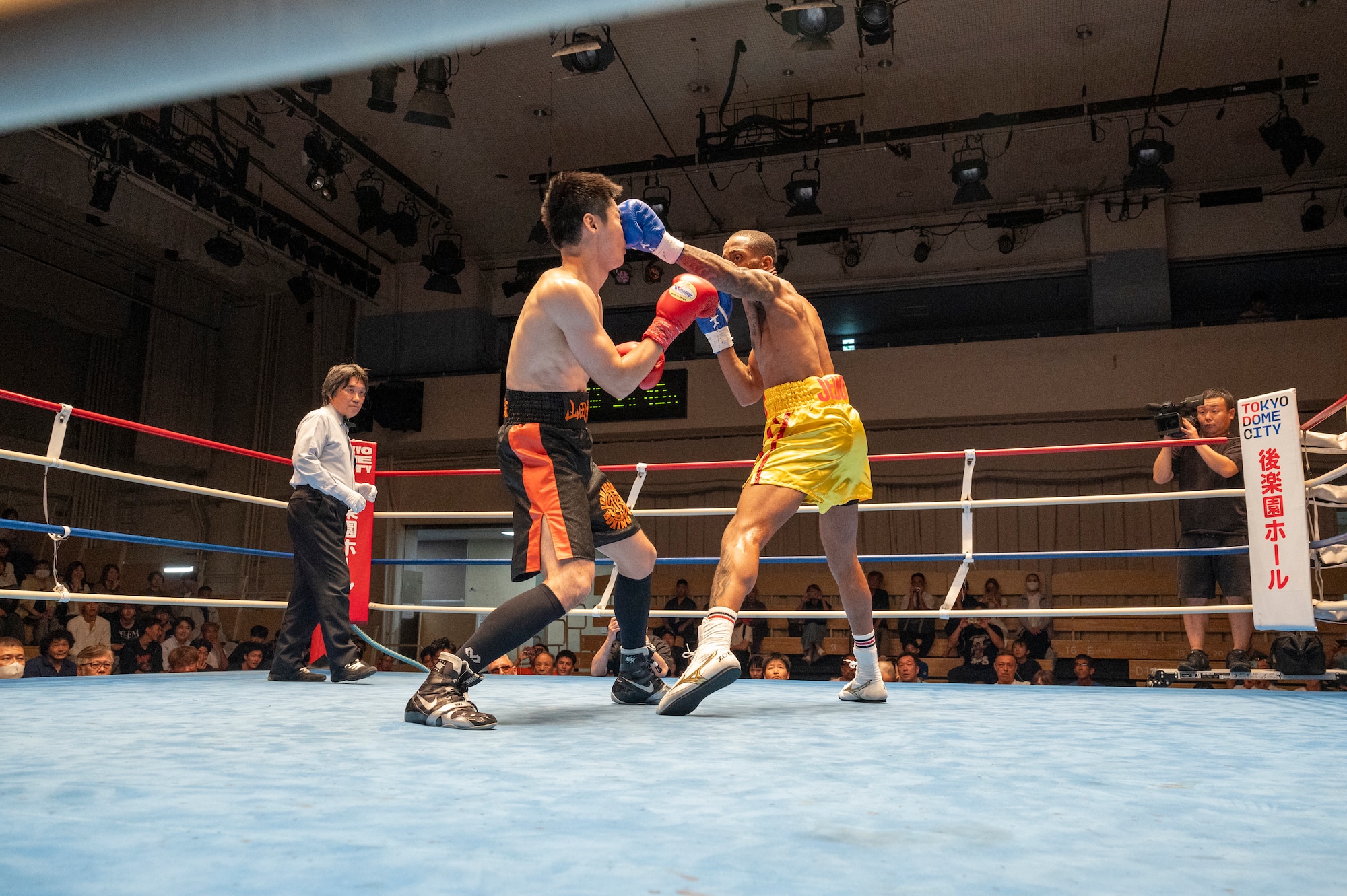 U.S. Air Force Senior Airman Craig Jeudy, Fifth Air Force technical support technician, lands a jab during the East-Japan Newcomer King tournament semifinal.