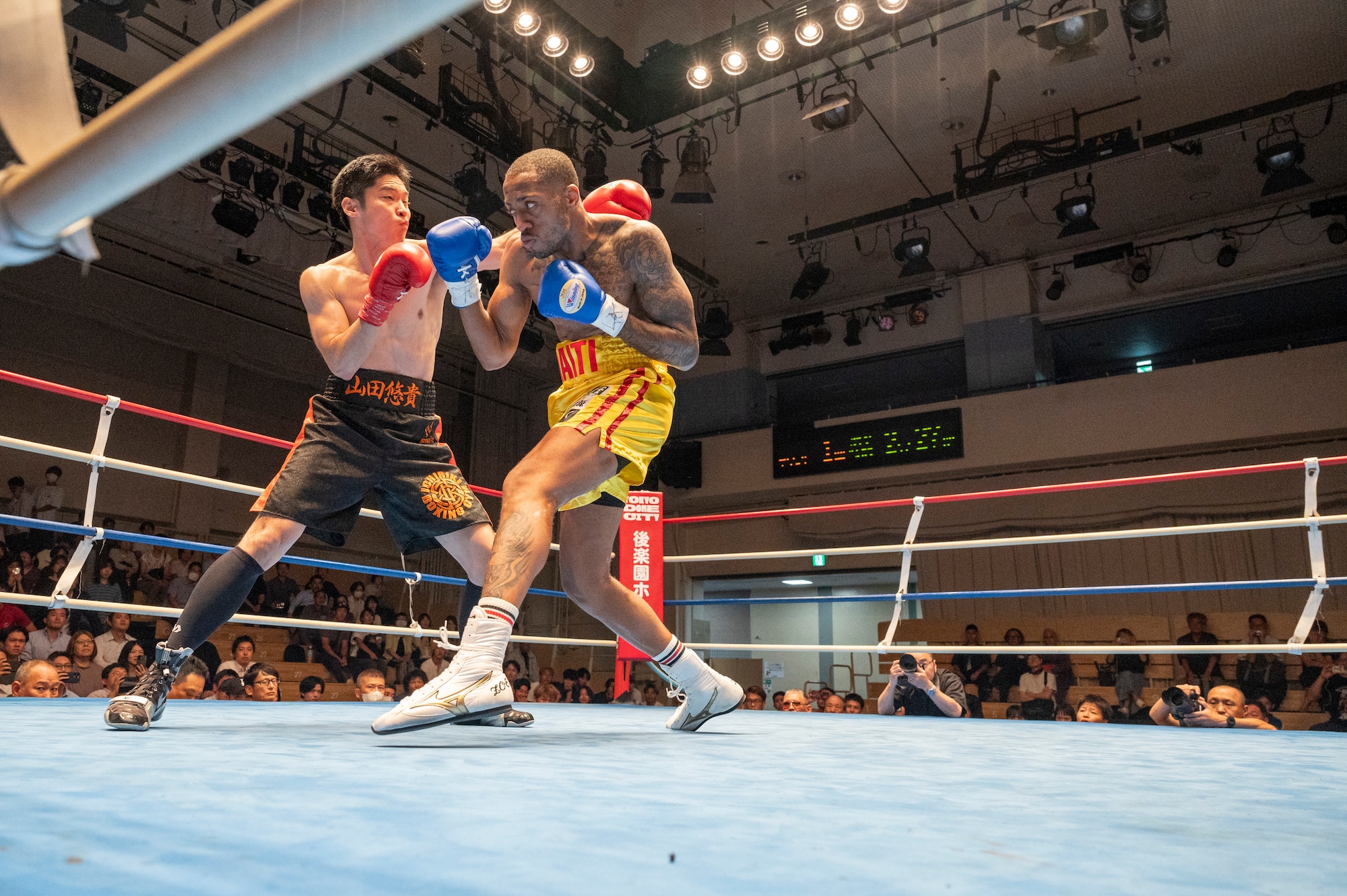 U.S. Air Force Senior Airman Craig Jeudy, Fifth Air Force technical support technician, dodges a punch during the East-Japan Newcomer King tournament semifinal.