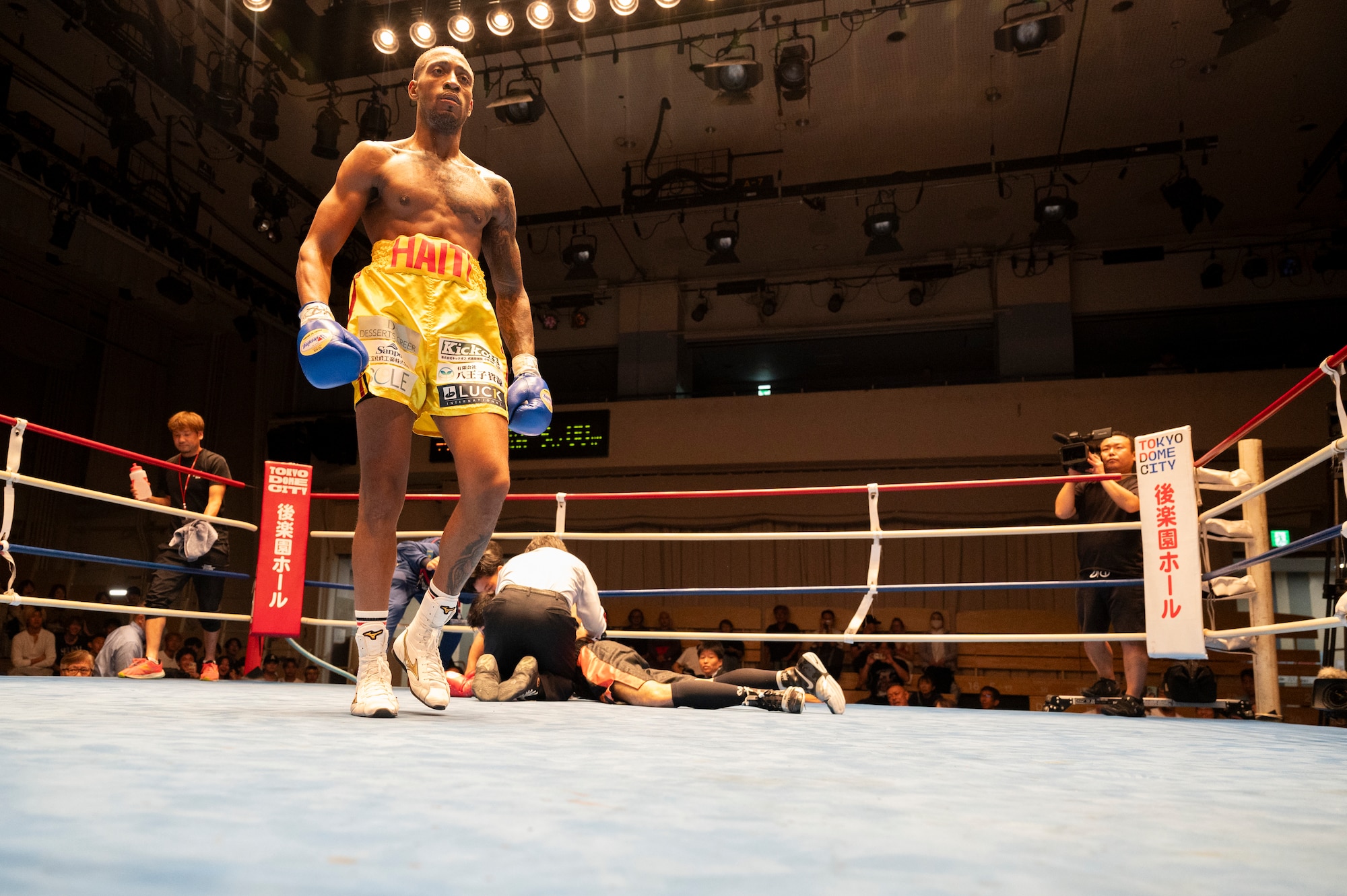 U.S. Air Force Senior Airman Craig Jeudy, Fifth Air Force technical support technician, walks off after knocking out his opponent during the East-Japan Newcomer King tournament semifinal.