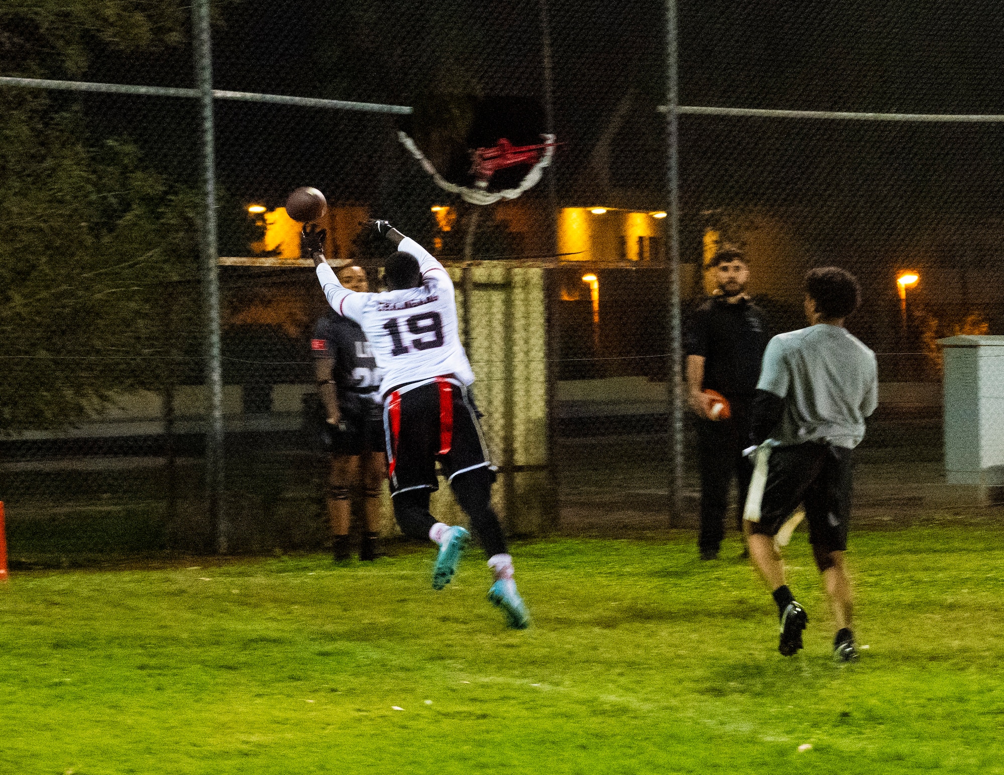 Airmen compete in an intramural flag football game