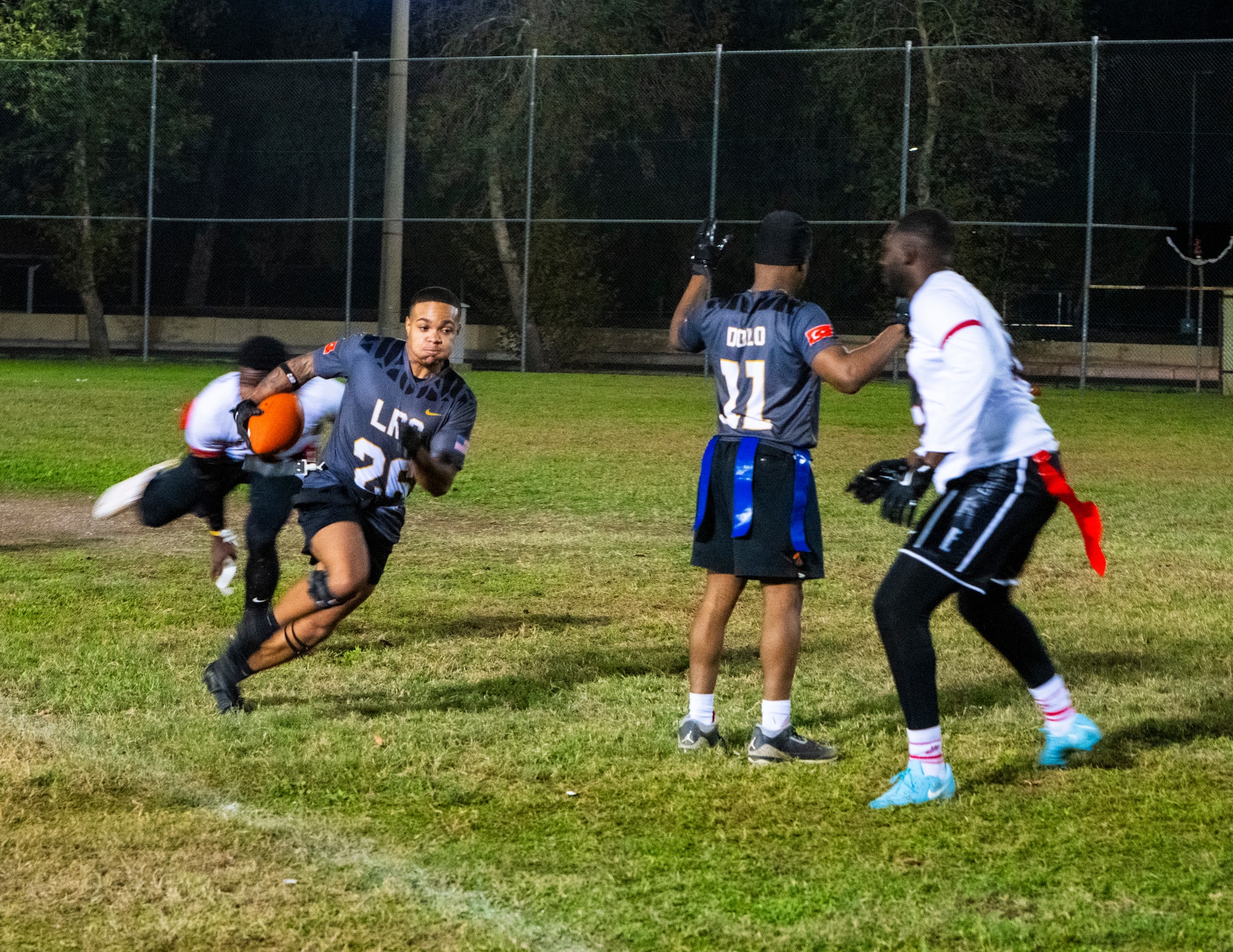 Airmen compete in an intramural flag football game