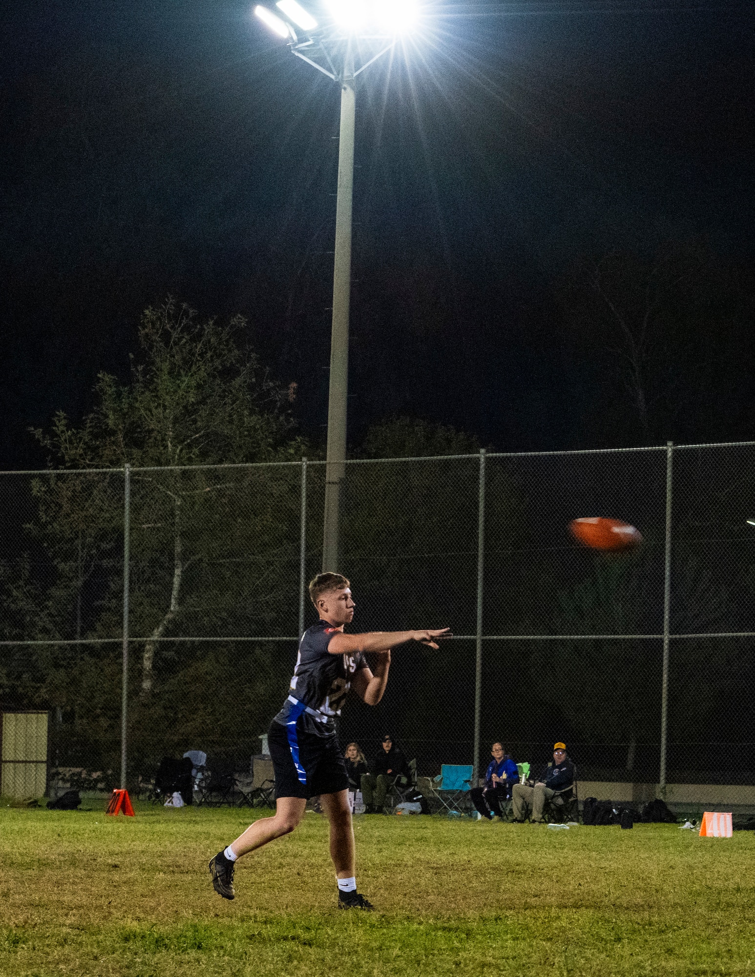 A U.S. Airman throws a football