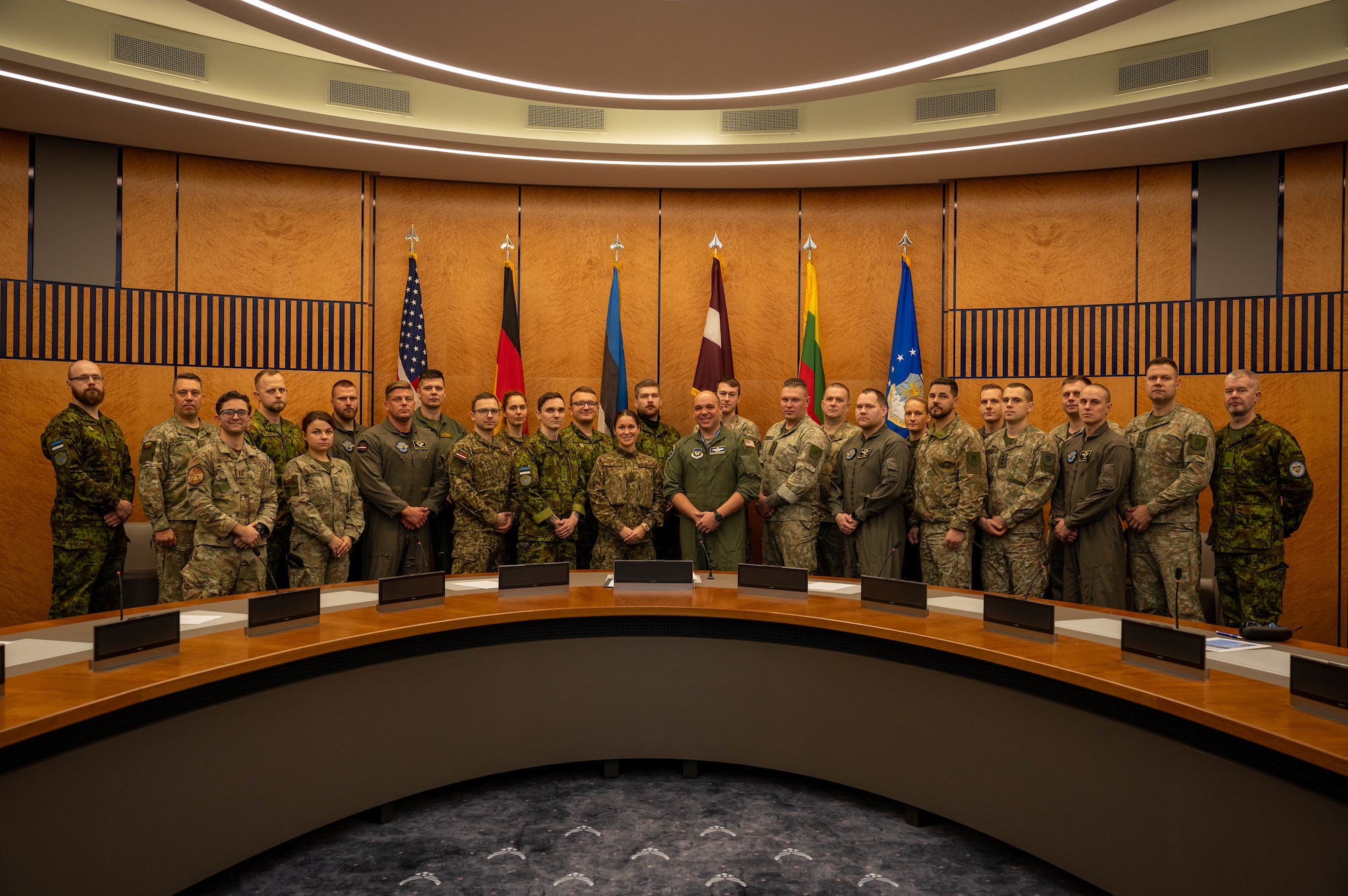 Baltic nation service members from across the Eastern European theater pose for a group photo in the U.S. Air Forces in Europe - Air Forces Africa Headquarters at Ramstein Air Base, Germany, Nov. 25, 2025.