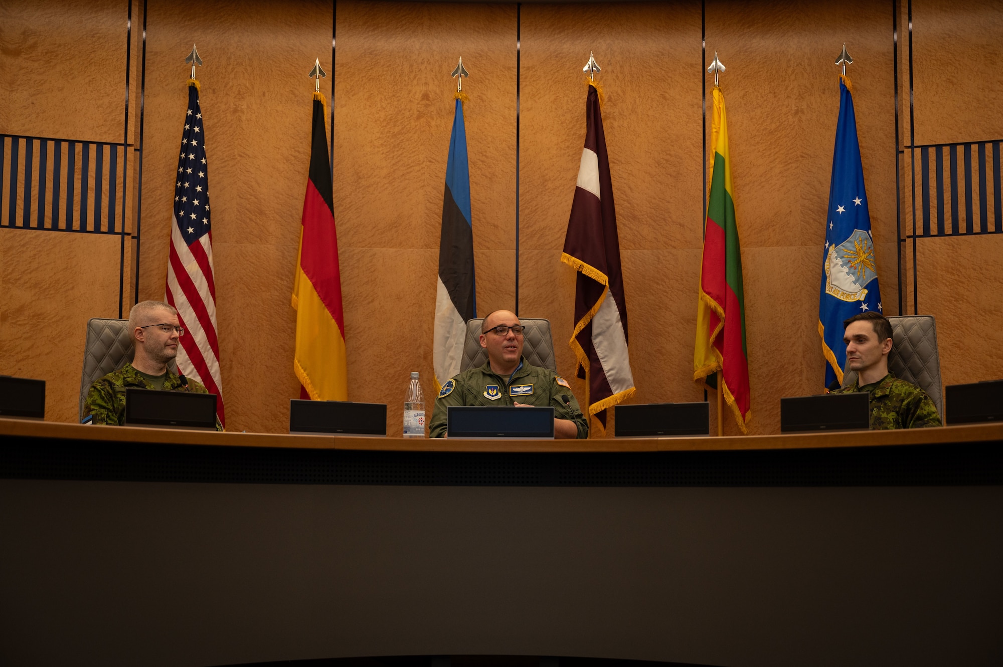 U.S. Air Force Col. Ryan Ferdinandsen, middle, U.S. Air Forces in Europe - Air Forces Africa deputy director of plans and programs, speaks to Baltic nation service members at the USAFE-AFAFRICA Headquarters at Ramstein Air Base, Germany, Nov. 25, 2025.