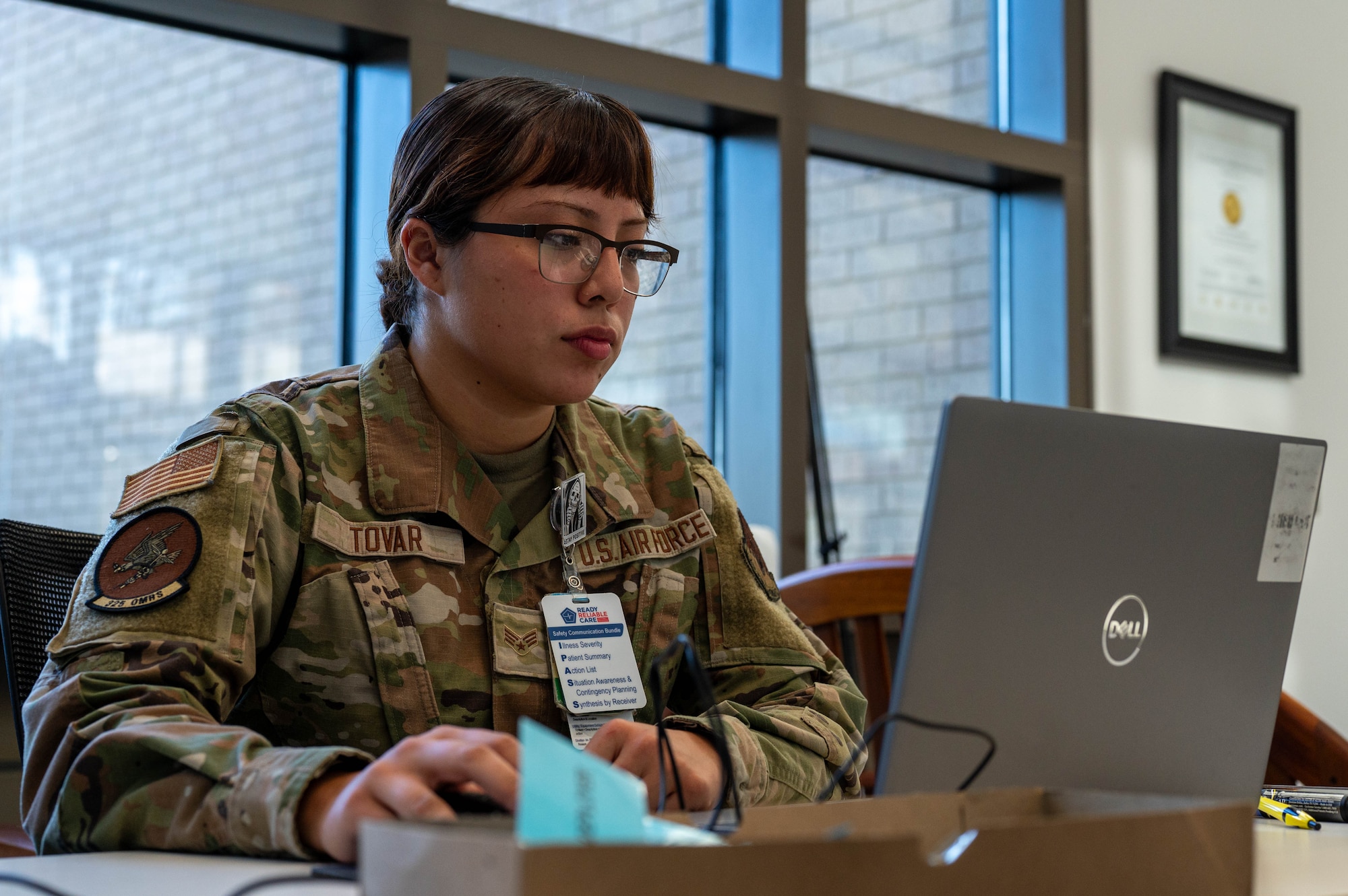 U.S. Air Force Senior Airman Marian Tovar, 325th Operational Medical Readiness Squadron public health technician, reviews data during a Personnel Deployment Function line at Tyndall Air Force Base.