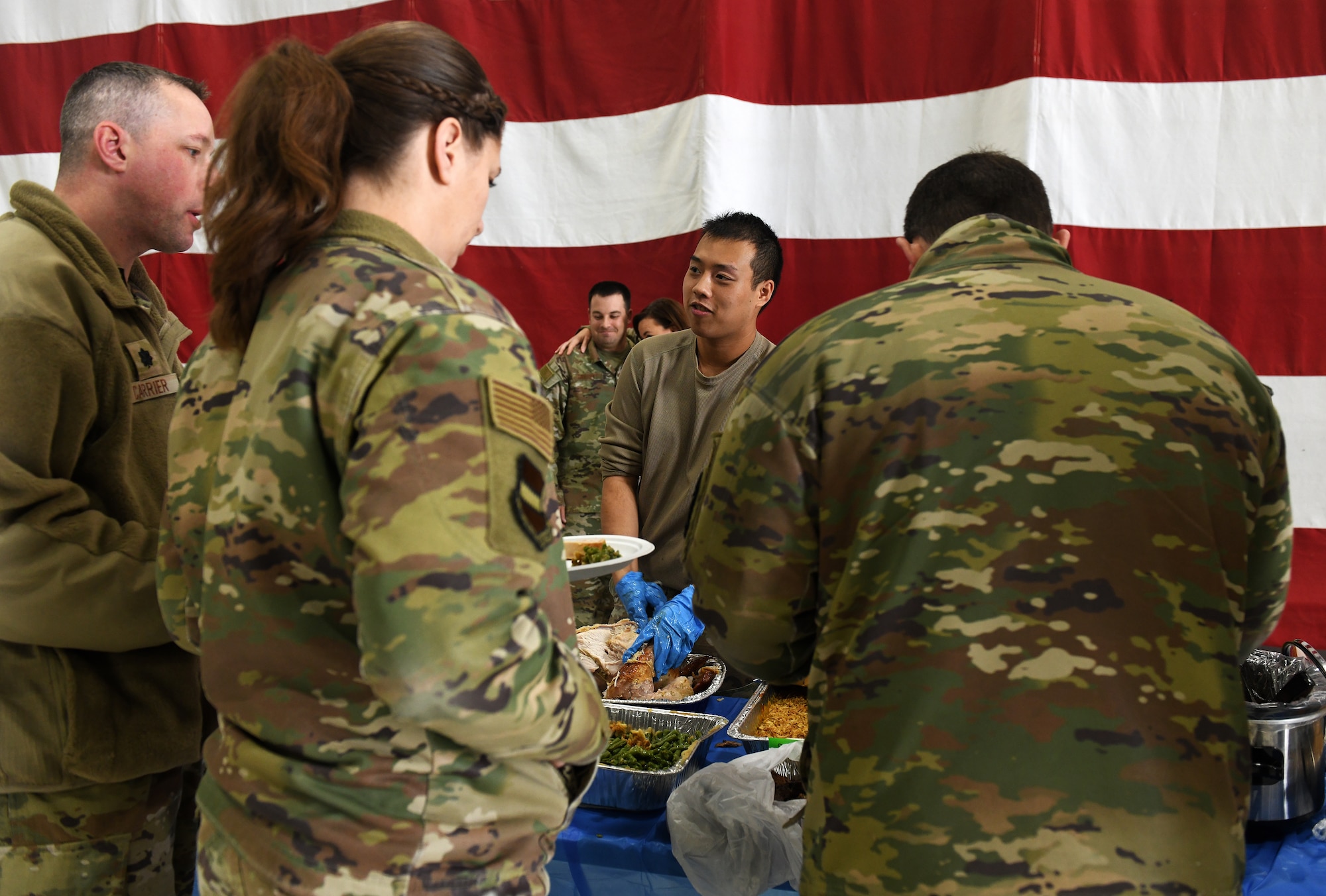 Airman Tran hands out turkey