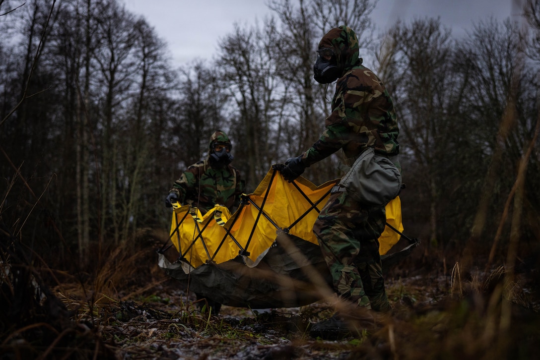 U.S. Marines with Combat Logistics Battalion 6, Combat Logistics Regiment 2, 2nd Marine Logistics Group, set up a decontamination basin during a chemical, biological, radiological, and nuclear field exercise as part of Exercise Freezing Winds 2025 in Dragsvik, Finland, Nov. 20, 2025.  The CBRN response force executed a CBRN FEX in order to support the commander’s efforts in mitigating the effects of a CBRN incident. Freezing Winds is conducted to increase interoperability between Marines, Finland, and NATO Allies by executing combined amphibious operations in and around the Baltic Sea littorals, and is part of a regularly occurring series of exercises in northern Europe that demonstrates the capability to deploy and train Marines and Sailors in support of the NATO Alliance. (U.S. Marine Corps photo by Sgt. Alfonso Livrieri)
